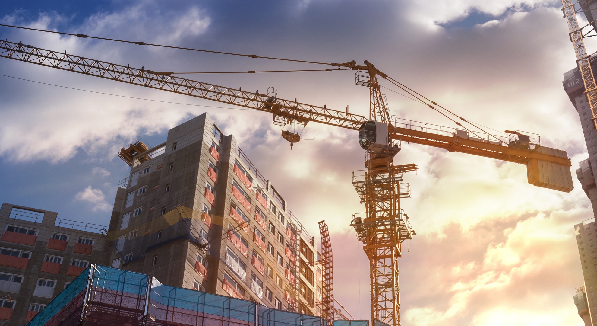 Buildings and Crane at a Construction Site
