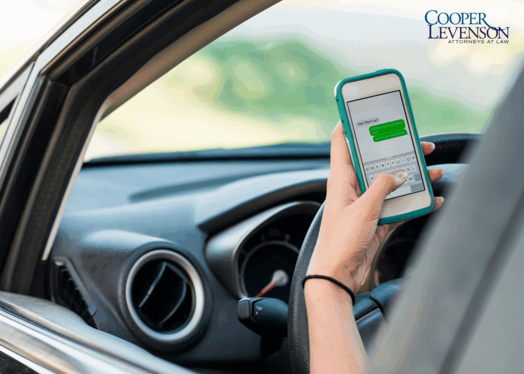 Driver sending a text message while behind the wheel