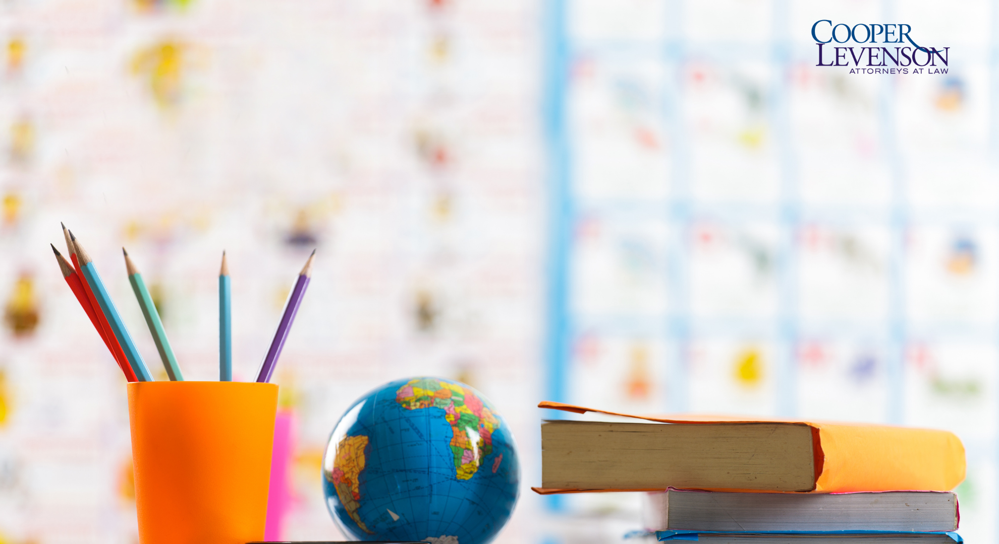 Desk with pencils and books in a classroom