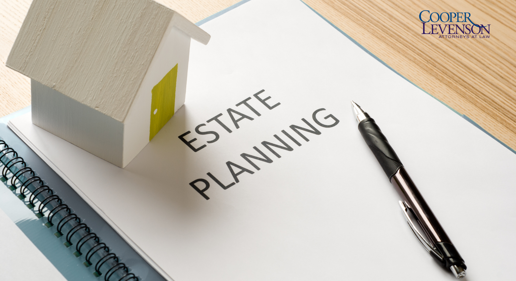 Documents that say Estate Planning with a House and Pen