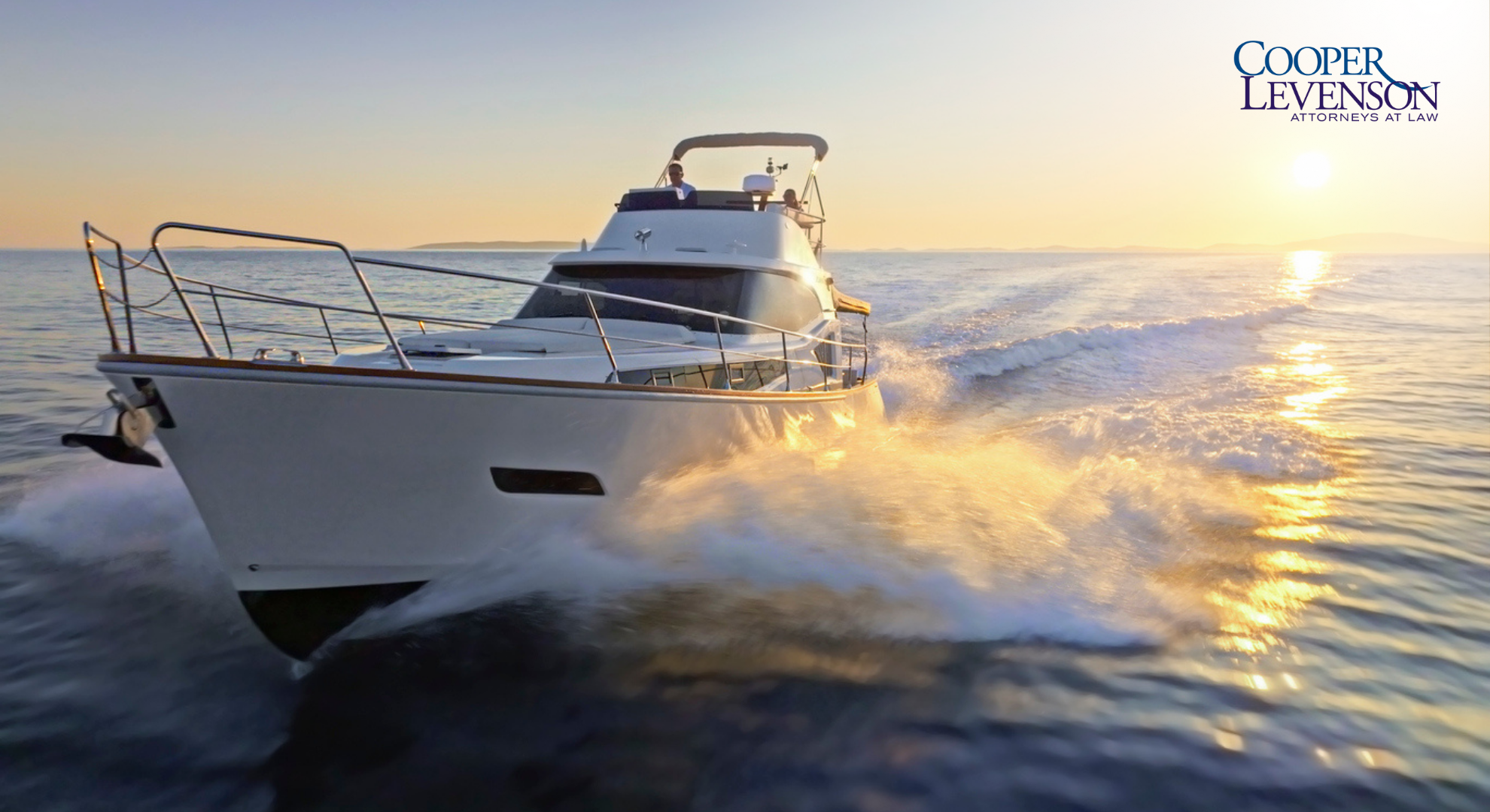 Large boat making a wake as the sun rises.
