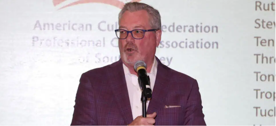 Photo of Ken Calemmo presenting at a FoodBank Evnt
