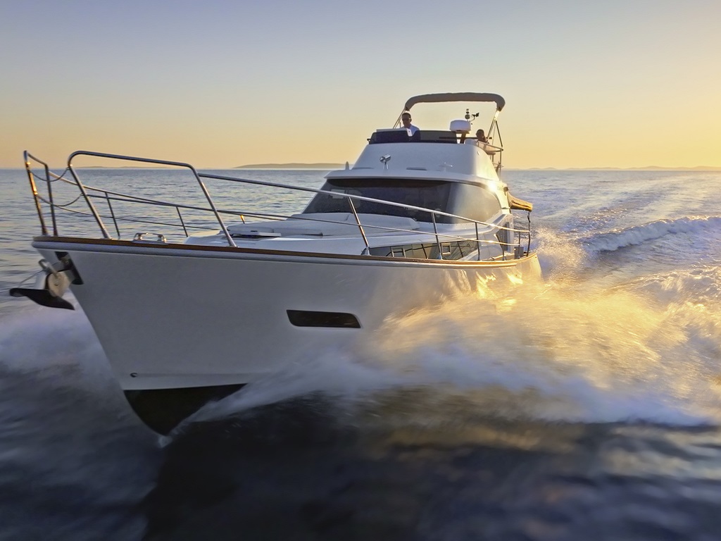 Couple sailing luxurious yacht
