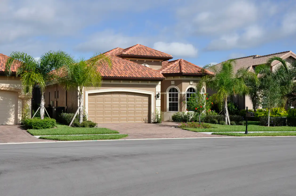 New home in Florida on a palm tree lined street